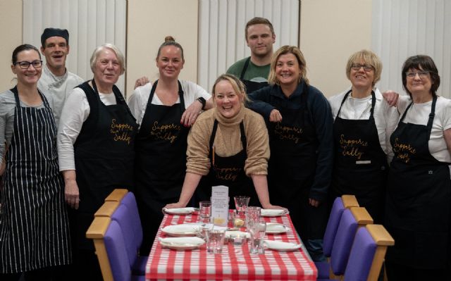 Volunteers around table Volunteers around table